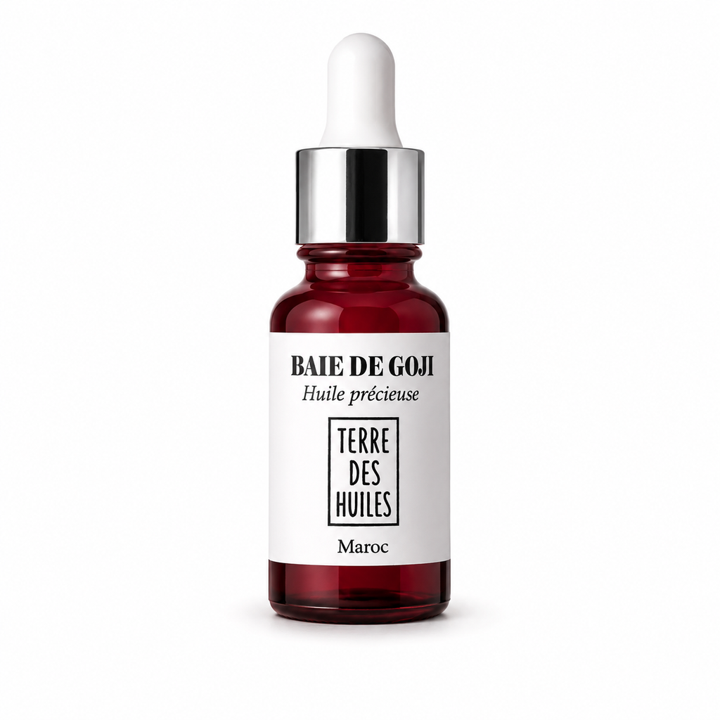 Flacon huile précieuse baie de goji Terre Des Huiles avec pipette argentée sur fond blanc minimaliste et élégant.