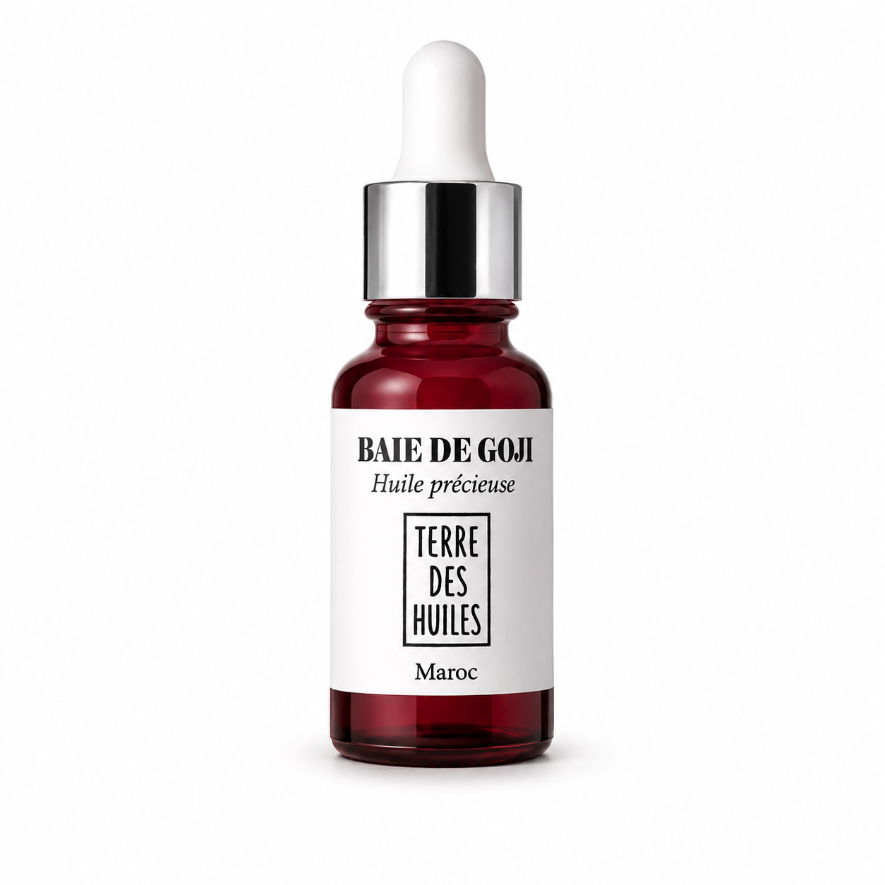 Flacon huile précieuse baie de goji Terre Des Huiles avec pipette argentée sur fond blanc minimaliste et élégant.